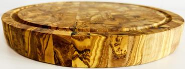 Preview: Olivenholz Schneidebrett rund 30 cm – 2‑in‑1 Holzblock für Schnitt & Service Preview: Beidseitig verwendbares Schneidebrett mit Saftrille & glatter Servierfläche.